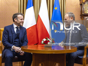 Prime Minister Donald Tusk (R) and French President Emmanuel Macron during a meeting at the Prime Minister's Office in Warsaw. The leaders w...