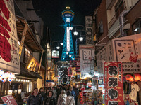 The street is full of tourists in Shinsekai, where Tsutenkaku Tower is within sight in Osaka, Japan, on December 12, 2024. Shinsekai, which...