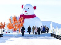 Tourists play at the Manzhouli ''Ice and Snow Nursery Rhyme'' theme park in Hulunbuir, Inner Mongolia, China, on December 12, 2024. (