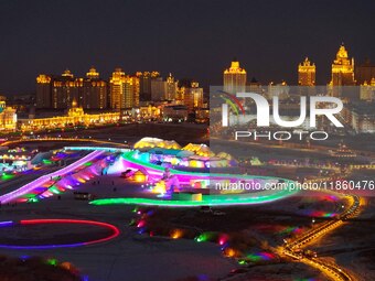 Tourists play at the Manzhouli ''Ice and Snow Nursery Rhyme'' theme park in Hulunbuir, Inner Mongolia, China, on December 12, 2024. (