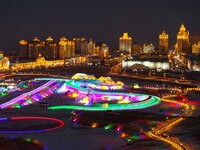 Tourists play at the Manzhouli ''Ice and Snow Nursery Rhyme'' theme park in Hulunbuir, Inner Mongolia, China, on December 12, 2024. (