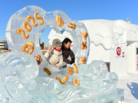 Tourists play at the Manzhouli ''Ice and Snow Nursery Rhyme'' theme park in Hulunbuir, Inner Mongolia, China, on December 12, 2024. (