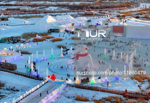 Tourists play at the Manzhouli ''Ice and Snow Nursery Rhyme'' theme park in Hulunbuir, Inner Mongolia, China, on December 12, 2024. 