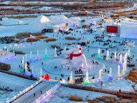 Tourists play at the Manzhouli ''Ice and Snow Nursery Rhyme'' theme park in Hulunbuir, Inner Mongolia, China, on December 12, 2024. (