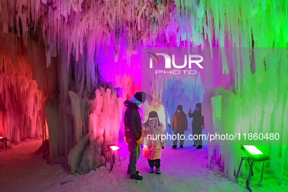 Tourists play at the Manzhouli ''Ice and Snow Nursery Rhyme'' theme park in Hulunbuir, Inner Mongolia, China, on December 12, 2024. 