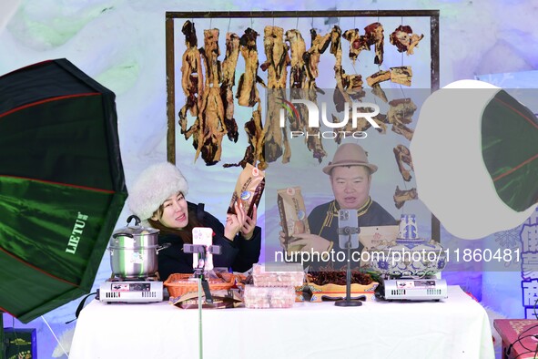 Tourists play at the Manzhouli ''Ice and Snow Nursery Rhyme'' theme park in Hulunbuir, Inner Mongolia, China, on December 12, 2024. 