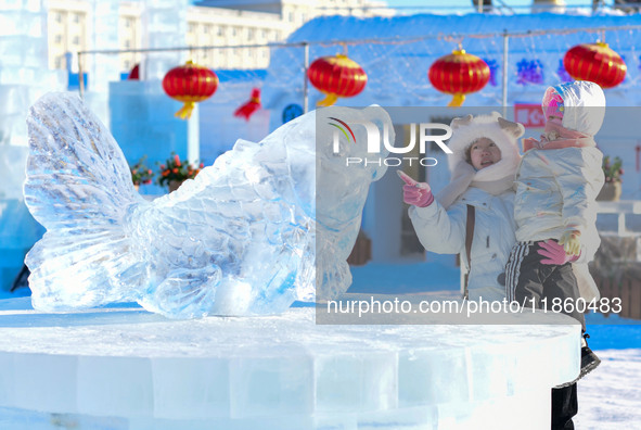 Tourists play at the Manzhouli ''Ice and Snow Nursery Rhyme'' theme park in Hulunbuir, Inner Mongolia, China, on December 12, 2024. 