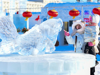 Tourists play at the Manzhouli ''Ice and Snow Nursery Rhyme'' theme park in Hulunbuir, Inner Mongolia, China, on December 12, 2024. (