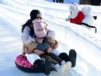 Tourists play at the Manzhouli ''Ice and Snow Nursery Rhyme'' theme park in Hulunbuir, Inner Mongolia, China, on December 12, 2024. (