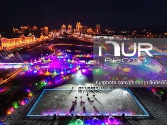 Tourists play at the Manzhouli ''Ice and Snow Nursery Rhyme'' theme park in Hulunbuir, Inner Mongolia, China, on December 12, 2024. (