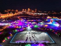 Tourists play at the Manzhouli ''Ice and Snow Nursery Rhyme'' theme park in Hulunbuir, Inner Mongolia, China, on December 12, 2024. (