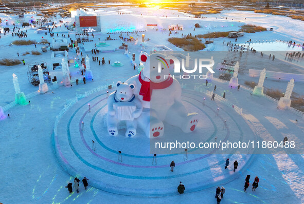 Tourists play at the Manzhouli ''Ice and Snow Nursery Rhyme'' theme park in Hulunbuir, Inner Mongolia, China, on December 12, 2024. 