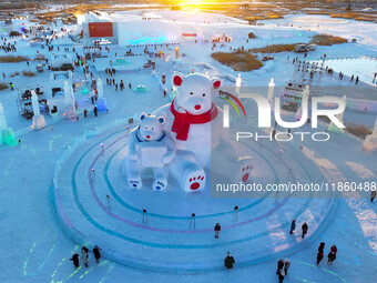 Tourists play at the Manzhouli ''Ice and Snow Nursery Rhyme'' theme park in Hulunbuir, Inner Mongolia, China, on December 12, 2024. (