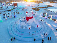 Tourists play at the Manzhouli ''Ice and Snow Nursery Rhyme'' theme park in Hulunbuir, Inner Mongolia, China, on December 12, 2024. (