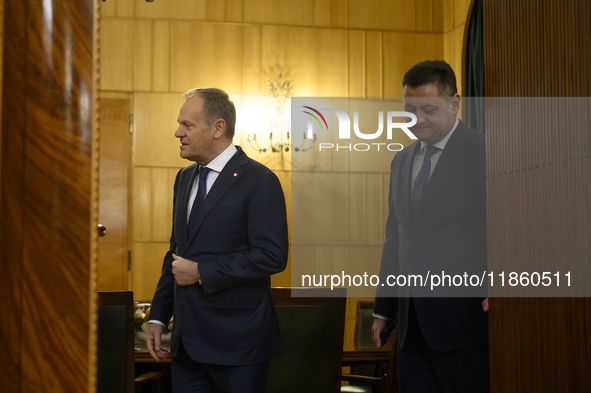 Polish Prime Minister Donald Tusk welcomes French President Emmanuel Macron in Warsaw, Poland, on December 11, 2024. 