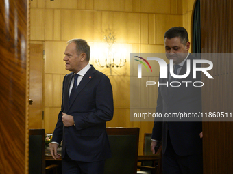 Polish Prime Minister Donald Tusk welcomes French President Emmanuel Macron in Warsaw, Poland, on December 11, 2024. (