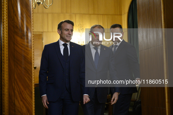 Polish Prime Minister Donald Tusk welcomes French President Emmanuel Macron in Warsaw, Poland, on December 11, 2024. 