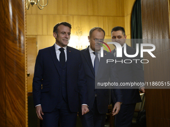 Polish Prime Minister Donald Tusk welcomes French President Emmanuel Macron in Warsaw, Poland, on December 11, 2024. (