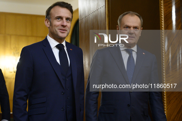 Polish Prime Minister Donald Tusk welcomes French President Emmanuel Macron in Warsaw, Poland, on December 11, 2024. 