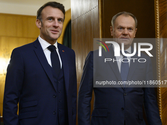 Polish Prime Minister Donald Tusk welcomes French President Emmanuel Macron in Warsaw, Poland, on December 11, 2024. (