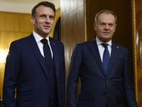 Polish Prime Minister Donald Tusk welcomes French President Emmanuel Macron in Warsaw, Poland, on December 11, 2024. (