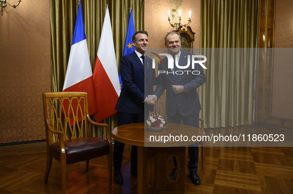 Polish Prime Minister Donald Tusk welcomes French President Emmanuel Macron in Warsaw, Poland, on December 11, 2024. 