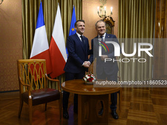 Polish Prime Minister Donald Tusk welcomes French President Emmanuel Macron in Warsaw, Poland, on December 11, 2024. (