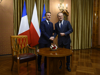 Polish Prime Minister Donald Tusk welcomes French President Emmanuel Macron in Warsaw, Poland, on December 11, 2024. (