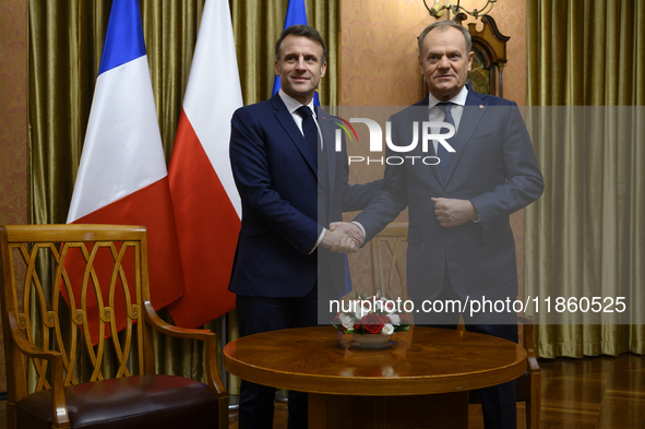 Polish Prime Minister Donald Tusk welcomes French President Emmanuel Macron in Warsaw, Poland, on December 11, 2024. 