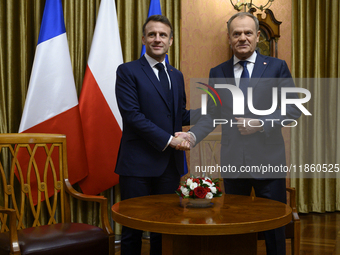 Polish Prime Minister Donald Tusk welcomes French President Emmanuel Macron in Warsaw, Poland, on December 11, 2024. (