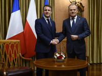 Polish Prime Minister Donald Tusk welcomes French President Emmanuel Macron in Warsaw, Poland, on December 11, 2024. (