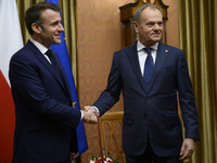 Polish Prime Minister Donald Tusk welcomes French President Emmanuel Macron in Warsaw, Poland, on December 11, 2024. (