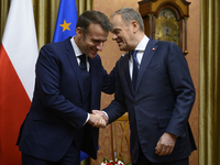 Polish Prime Minister Donald Tusk welcomes French President Emmanuel Macron in Warsaw, Poland, on December 11, 2024. (