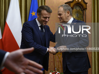 Polish Prime Minister Donald Tusk welcomes French President Emmanuel Macron in Warsaw, Poland, on December 11, 2024. (