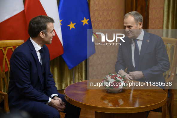 Polish Prime Minister Donald Tusk welcomes French President Emmanuel Macron in Warsaw, Poland, on December 12, 2024. 