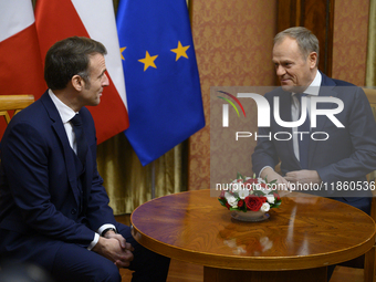 Polish Prime Minister Donald Tusk welcomes French President Emmanuel Macron in Warsaw, Poland, on December 12, 2024. (