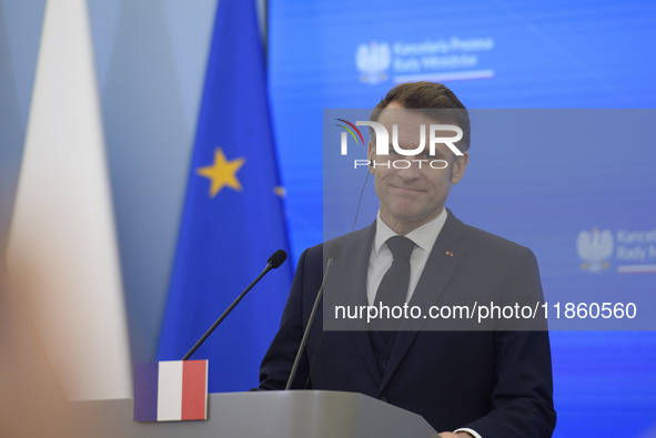 French President Emmanuel Macron looks on during a press conference with Polish Prime Minister Donald Tusk after talks in Warsaw, Poland, on...