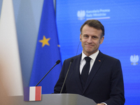 French President Emmanuel Macron looks on during a press conference with Polish Prime Minister Donald Tusk after talks in Warsaw, Poland, on...