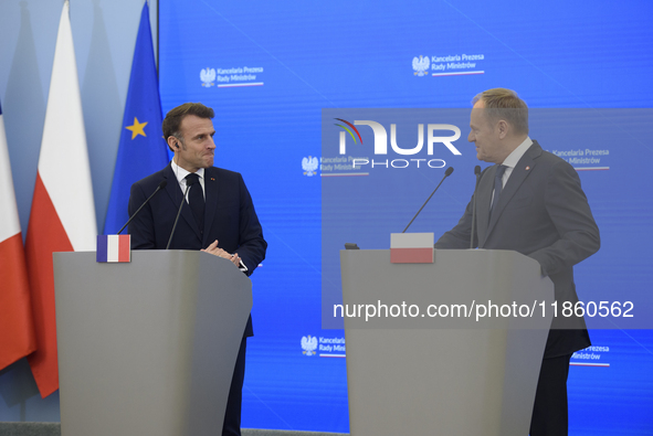 French President Emmanuel Macron and Polish Prime Minister Donald Tusk hold a press conference after talks in Warsaw, Poland, on December 12...