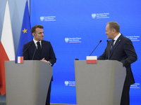 French President Emmanuel Macron and Polish Prime Minister Donald Tusk hold a press conference after talks in Warsaw, Poland, on December 12...