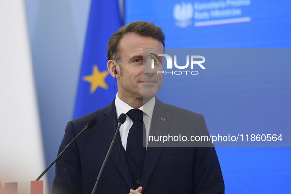 French President Emmanuel Macron looks on during a press conference with Polish Prime Minister Donald Tusk after talks in Warsaw, Poland, on...