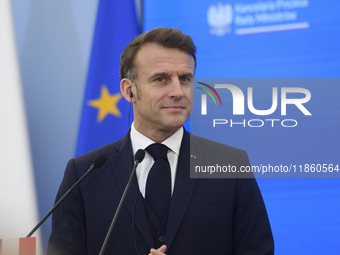 French President Emmanuel Macron looks on during a press conference with Polish Prime Minister Donald Tusk after talks in Warsaw, Poland, on...