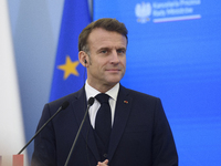 French President Emmanuel Macron looks on during a press conference with Polish Prime Minister Donald Tusk after talks in Warsaw, Poland, on...