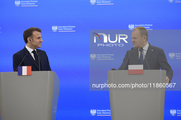 French President Emmanuel Macron and Polish Prime Minister Donald Tusk hold a press conference after talks in Warsaw, Poland, on December 12...