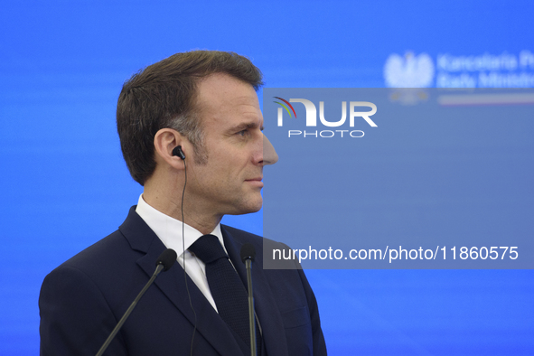 French President Emmanuel Macron looks on during a press conference with Polish Prime Minister Donald Tusk after talks in Warsaw, Poland, on...