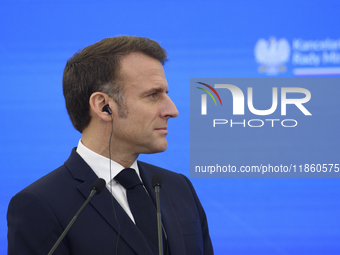 French President Emmanuel Macron looks on during a press conference with Polish Prime Minister Donald Tusk after talks in Warsaw, Poland, on...