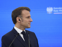 French President Emmanuel Macron looks on during a press conference with Polish Prime Minister Donald Tusk after talks in Warsaw, Poland, on...