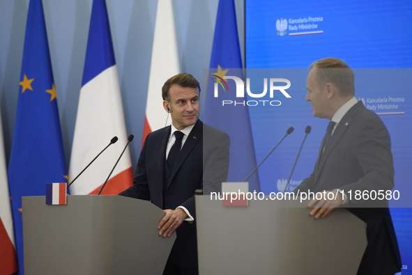 French President Emmanuel Macron and Polish Prime Minister Donald Tusk hold a press conference after talks in Warsaw, Poland, on December 12...