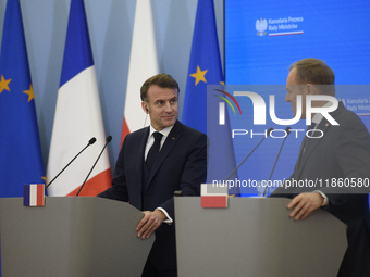 French President Emmanuel Macron and Polish Prime Minister Donald Tusk hold a press conference after talks in Warsaw, Poland, on December 12...