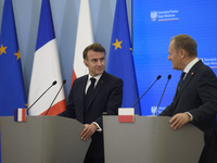 French President Emmanuel Macron and Polish Prime Minister Donald Tusk hold a press conference after talks in Warsaw, Poland, on December 12...